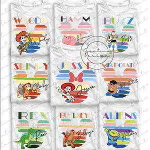May include: White t-shirts featuring various Toy Story characters like Woody, Buzz, and Jessie. Each shirt has a character's name and image within a Mickey Mouse-shaped design with colorful stripes. A fun and playful design.
