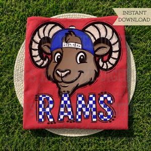 May include: A red t-shirt featuring a cartoon ram wearing a blue baseball cap, with the text RAMS in a blue and white checkered pattern below the ram. The graphic includes bold black outlines and the text INSTANT DOWNLOAD in the top corner.