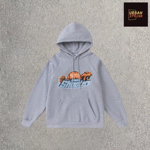 Grey Shooters Graphic Hoodie – Pullover Sweatshirt with Bold Streetwear Print