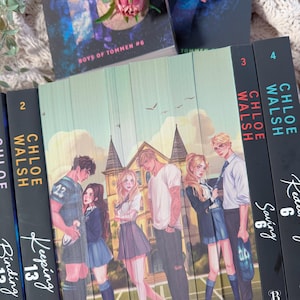 May include: A collection of Chloe Walsh books from the Boys of Tommen series, including Keeping 13, Saving 6, and Binding 13. The book spines feature illustrations of characters in school uniforms standing in front of a building on a sports field.