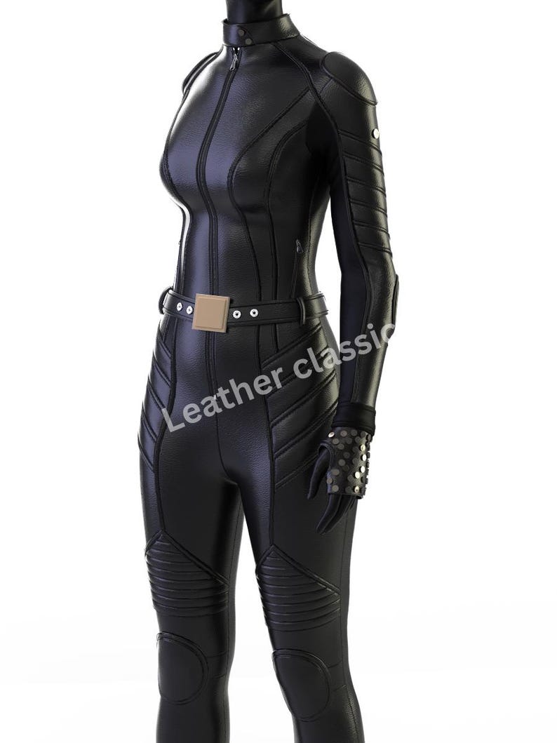May include: A black, form-fitting jumpsuit with a high collar and long sleeves. The suit features a front zipper, a belt with a square buckle, and quilted detailing on the legs. The text "Leather classic" is visible on the garment.