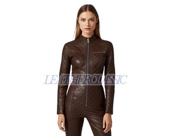 May include: A brown leather jumpsuit with a quilted pattern. The jumpsuit has a high collar, long sleeves, and a full-length zipper. The text "LEATHERCLASSIC" is visible in the image.