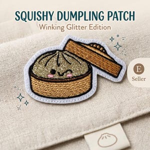 May include: An embroidered patch featuring a gold glitter dumpling with a winking face and pink cheeks inside a brown bamboo steamer basket. The text SQUISHY DUMPLING PATCH Winking Glitter Edition is printed above the patch on a beige fabric.