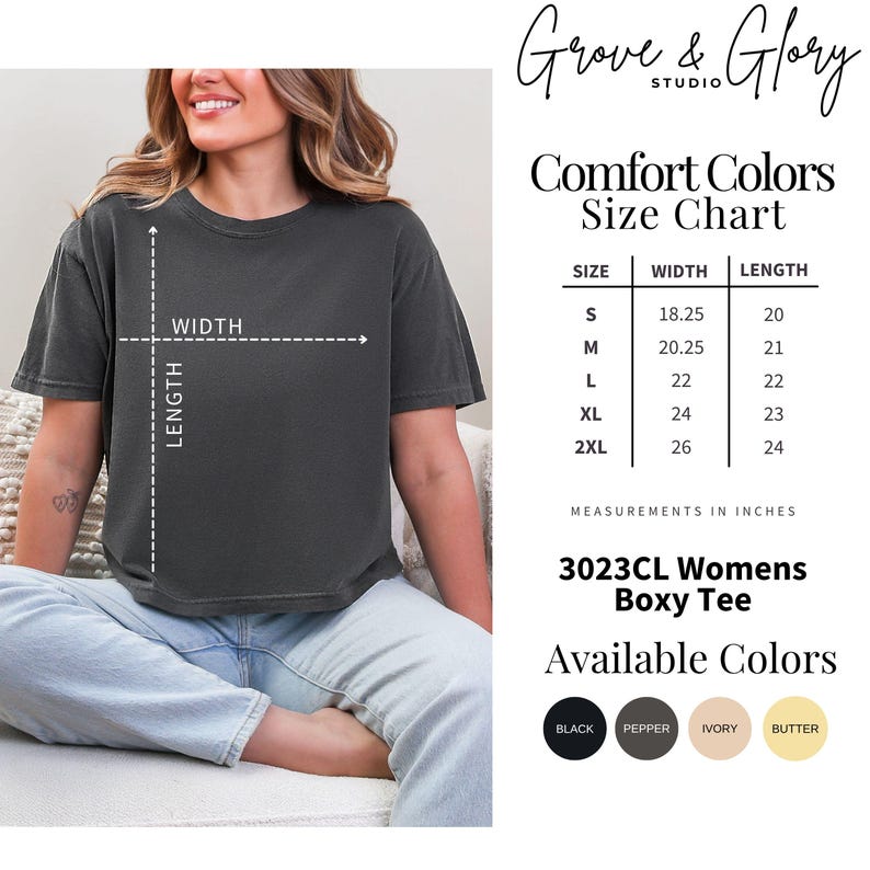 May include: A charcoal grey boxy t-shirt with a size chart showing measurements in inches for sizes S through 2XL. The chart lists widths from 18.25 to 26 and lengths from 20 to 24. Available colors include black, pepper, ivory, and butter.
