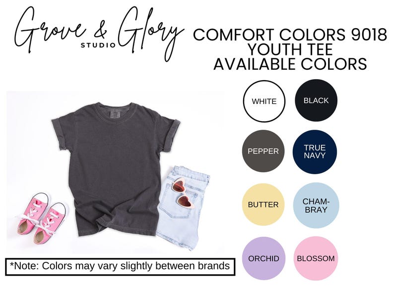 May include: A dark gray youth tee shirt with rolled sleeves, paired with light blue denim shorts and pink sneakers. The image also displays a color chart with options like white, black, pepper, and true navy. Text reads "Grove & Glory Studio".