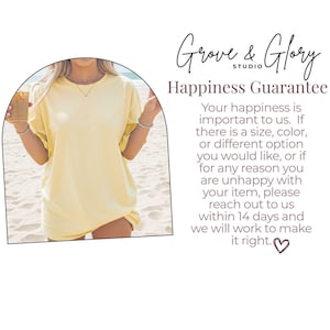 May include: A light yellow t-shirt with short sleeves. The shirt is worn by a person on a beach. The text "Grove & Glory Studio" and "Happiness Guarantee" are visible in the image.
