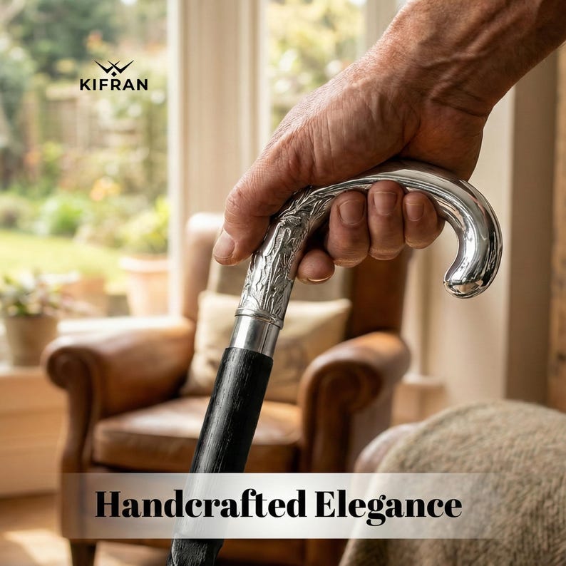 May include: A silver-handled walking cane with a black shaft is held in a hand. The handle has an ornate floral design. The text "Handcrafted Elegance" is at the bottom of the image.