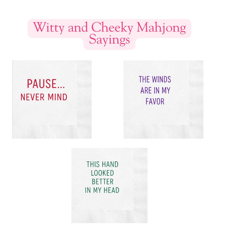 May include: Three white cocktail napkins with witty Mahjong sayings. One napkin reads "PAUSE... NEVER MIND" in red. Another says "THE WINDS ARE IN MY FAVOR" in purple. The third says "THIS HAND LOOKED BETTER IN MY HEAD" in green.