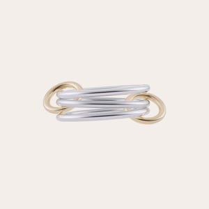May include: A multi-band ring featuring three smooth silver-toned bands interlocked with two gold-toned circular links on the ends. The design consists of five connected rings that overlap horizontally, creating a layered and polished metallic appearance.
