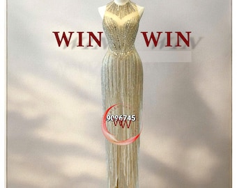 El vestido de diamantes de imitación de alta gama está completamente cosido a mano.