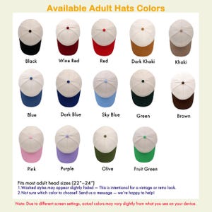 May include: A collection of baseball caps in various colors, including black, red, and blue. Each cap has a white crown and a colored brim. The text "Available Adult Hats Colors" is at the top. The hats fit most adult head sizes (22"-24").