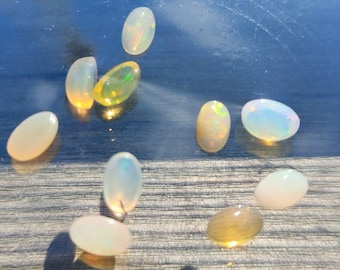 Natural Ethiopian Fire Opal Lot – 10 Faceted Cabochon Gems (Approx. 1.5 Carats Total) | Flashy Play-of-Color, Jewelry & Collector Quality!