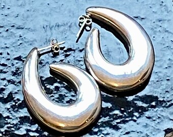 Big sterling silver earrings, lightweight showy half hoop swirls on posts. Silver lovers unite!