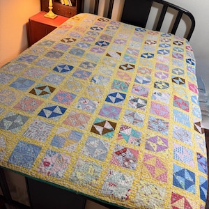 Small vintage bow tie quilt, hand sewn, machine quilted, old fabrics cheery colors, tattered cutter, upcycle or wall hanging? 69x78”