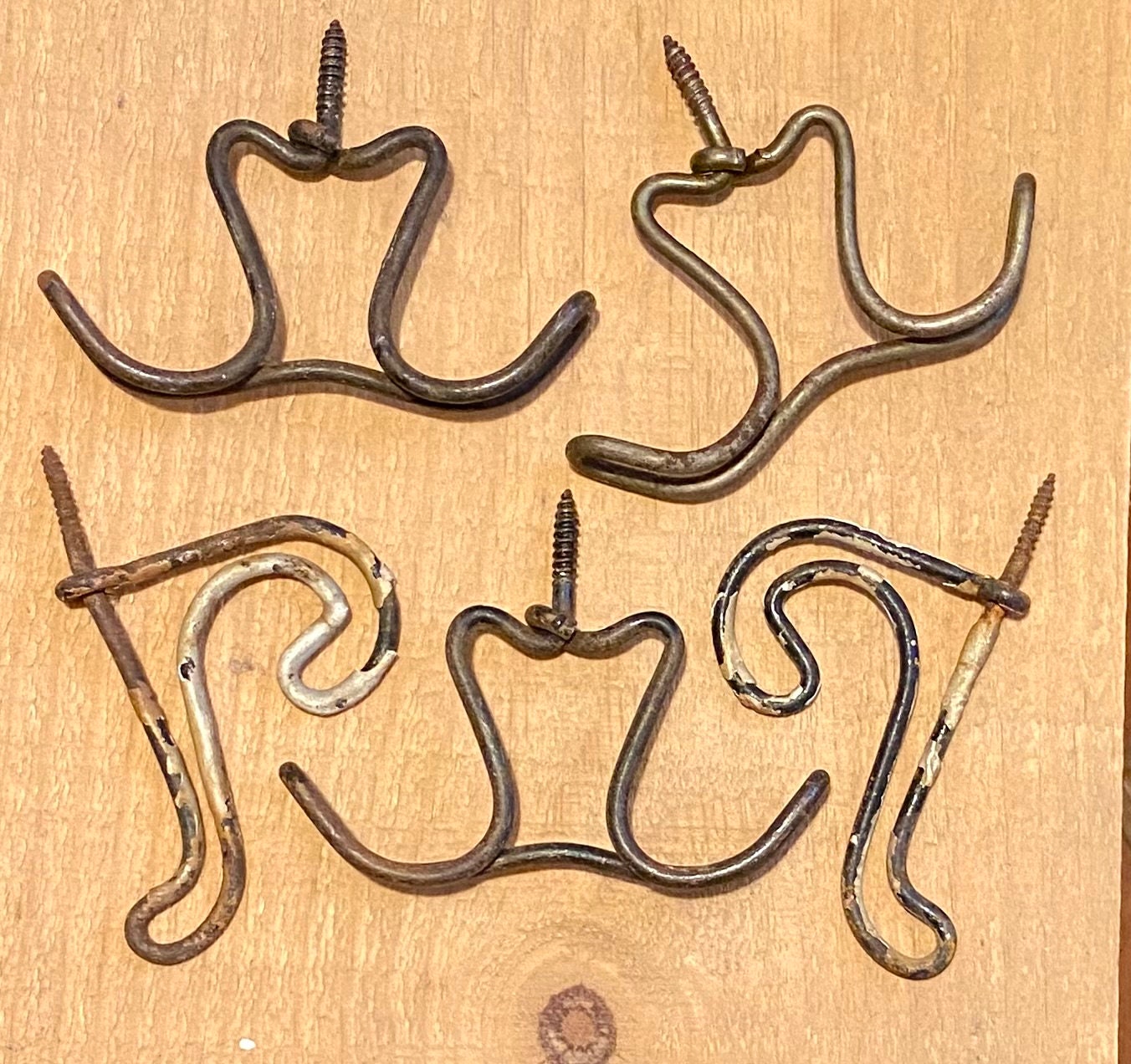 Lot of 5 wire coat hooks. Old and crusty and good. Vintage rustic hardware.  Chippy black paint. Restoration hardware, make a coat rack ?