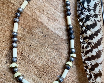 Vintage Pueblo style bench beads and bone necklace. Sterling silver beads, carved bone beads and silver tone clasp, very old- family owned