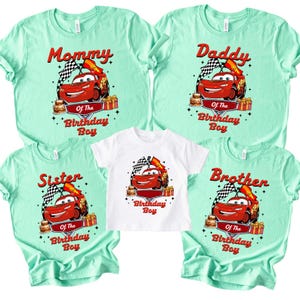 May include: A set of matching t-shirts in mint green and white. Each shirt displays a red race car graphic with the text "Mommy", "Daddy", "Sister", "Brother", and "Of The Birthday Boy". The shirts are for a birthday celebration.