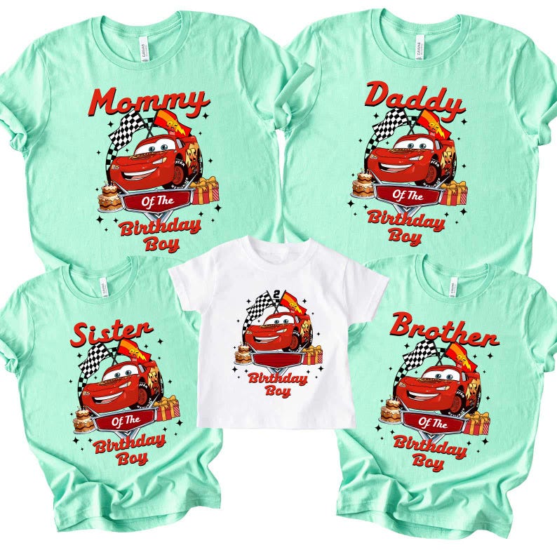 May include: A set of matching t-shirts in mint green and white. Each shirt displays a red race car graphic with the text "Mommy", "Daddy", "Sister", "Brother", and "Of The Birthday Boy". The shirts are for a birthday celebration.