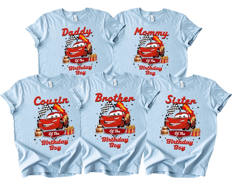 May include: Light blue t-shirts featuring a red race car graphic, a chequered flag, and the text "Daddy", "Mommy", "Cousin", "Brother", and "Sister" above "Of The Birthday Boy".