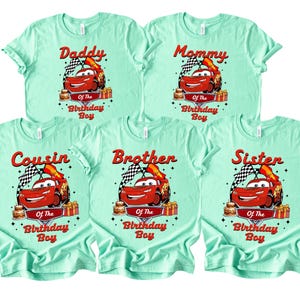 May include: Five mint green t-shirts featuring a cartoon car design. Each shirt is labelled with a different family role: "Daddy", "Mommy", "Cousin", "Brother", and "Sister". The graphic includes the text "Of The Birthday Boy".