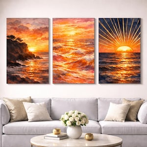 May include: Three-panel wall art depicting a sunset over the ocean. The artwork features vibrant orange, yellow, and blue hues, with the sun reflecting on the water. The first panel shows a cliffside with trees, while the others focus on the waves and the sun.