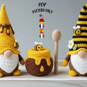 May include: A collection of handmade crochet items, including two gnomes with yellow and brown hats, a honey pot, and a honey dipper. The gnomes have white beards and bee accents. The text "PDF PATTERN ONLY" is visible.