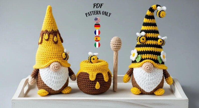 May include: A collection of handmade crochet items, including two gnomes with yellow and brown hats, a honey pot, and a honey dipper. The gnomes have white beards and bee accents. The text "PDF PATTERN ONLY" is visible.