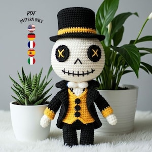 May include: A crocheted skeleton doll wearing a black top hat with a yellow band, a black jacket with yellow accents, and a yellow vest. The doll has black eyes and a stitched mouth. The text "PDF PATTERN ONLY" is in the upper left corner.