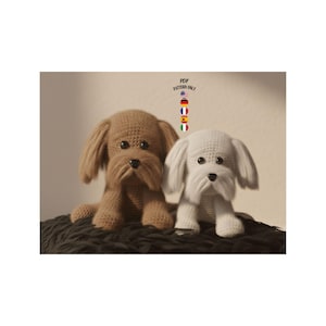 May include: Two crocheted dog toys, one brown and one white, are displayed. The dogs have long, floppy ears and a shaggy appearance. The text "PDF PATTERN ONLY" is visible in the upper right corner, along with flags.