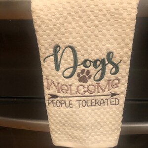 Dish towel  with funny quote about dogs welcome on a ivory waffle terry  dish towel.