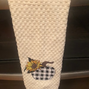 Dish towel fall theme black and white checked pumpkin with sunflower.-