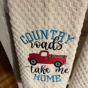 Dish towel embroidered with red truck and country roads