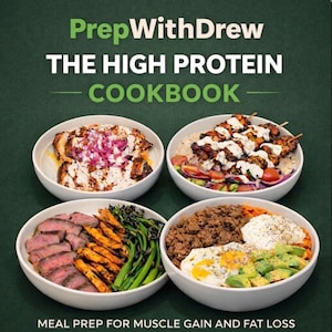 May include: Image of a cookbook cover with the title "PrepWithDrew THE HIGH PROTEIN COOKBOOK." The image features four white bowls filled with various high-protein meals, including grilled chicken, steak, and ground meat. The text at the bottom reads "MEAL PREP FOR MUSCLE GAIN AND FAT LOSS."