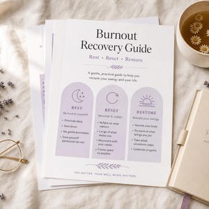 May include: A white paper guide titled Burnout Recovery Guide with the subtitle Rest, Reset, Restore. It features three purple arched sections with icons and text lists, alongside a mug of tea with flowers, lavender sprigs, glasses, and a notebook.