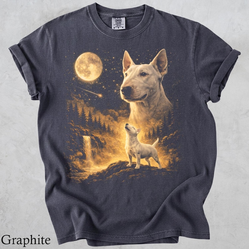 May include: A graphite-coloured short-sleeve t-shirt featuring a graphic print of a large Bull Terrier head above a smaller standing Bull Terrier in a forest landscape with a waterfall, a bright full moon, and a shooting star in the night sky.