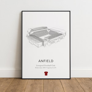 May include: A framed print featuring a detailed line drawing of Anfield stadium. The print includes the text "ANFIELD" and information about Liverpool Football Club. A red jersey icon is at the bottom.
