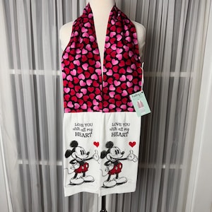 May include: A Valentine's Day themed kitchen towel set. The top scarf is black with pink and red hearts. The bottom towels are white with a Mickey Mouse graphic and the text "LOVE YOU with all my HEART".