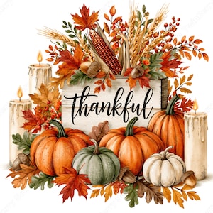 May include: A decorative arrangement featuring a wooden sign with the word thankful, surrounded by orange, green, and white pumpkins, three lit pillar candles, autumn maple leaves, wheat stalks, red berries, and acorns on a white background.