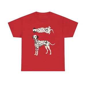 May include: A red short-sleeved t-shirt featuring a graphic print of two Dalmatian dogs. One dog is depicted standing in profile, while the other is shown lying down in a horizontal position. Both dogs have white coats with black spots.