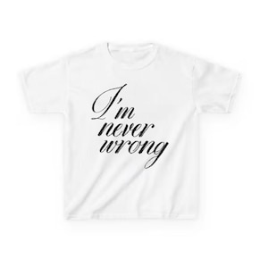 May include: White t-shirt with the phrase "I'm never wrong" in black cursive script. The text is centered on the front of the shirt. The shirt has short sleeves and a crew neck.