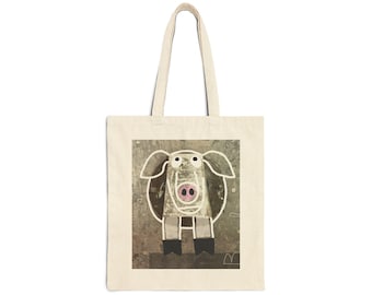 May include: Cream-colored tote bag featuring a whimsical pig illustration. The pig is outlined in white with a pink nose and black hooves, set against a mottled gray background. The bag has long handles for carrying.