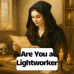 May include: An artistic image of a person in a black hooded cloak reading a letter. The text "Are You a Lightworker" is displayed on a white rectangle. Lit candles and a skull are on the wooden table.