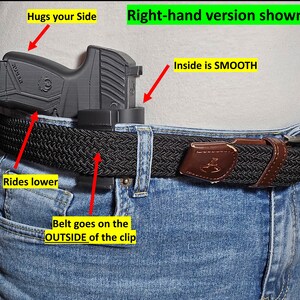 May include: A black handgun holster attached to a black woven belt worn with blue jeans. The holster is designed to ride lower and hug the side. The belt goes on the outside of the clip. The inside of the holster is smooth.