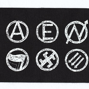 May include: Black fabric patch with six white circles containing various symbols, including an anarchy symbol, a letter E, a circle with a diagonal line and an arrow, a hammer and sickle, a swastika, and three parallel lines.