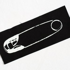 May include: A black fabric patch with a white outline of a safety pin.