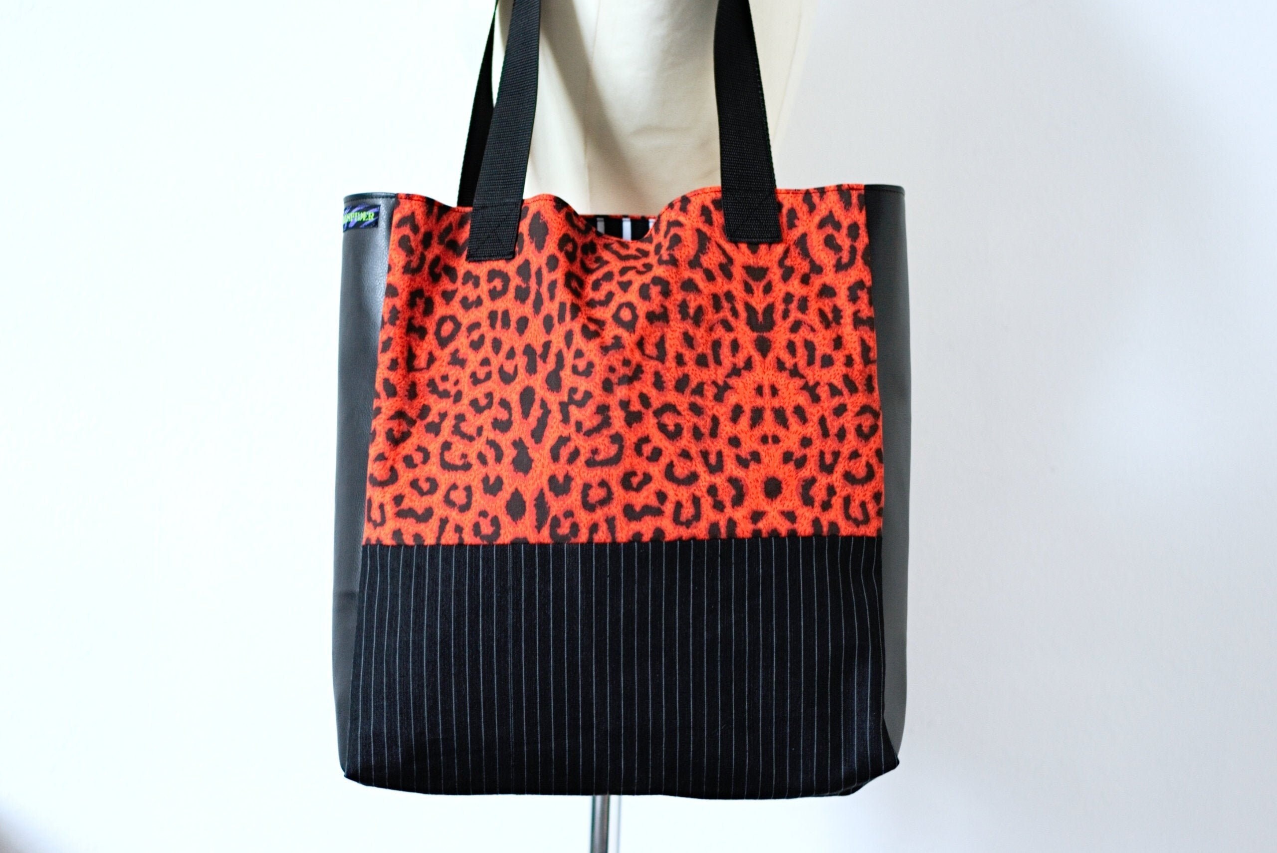 black tote with leopard lining