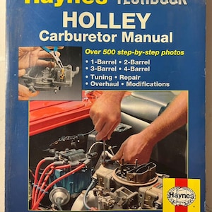 Könnte beinhalten: Ein Haynes Techbook-Handbuch für Holley-Vergaser. Das blaue Cover zeigt den Titel in Gelb und Weiß, mit Bildern von Vergaserkomponenten und Reparaturarbeiten. Enthält über 500 Schritt-für-Schritt-Fotos.
