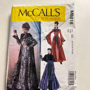 May include: A McCall's Costumes sewing pattern, M6818, featuring illustrations of costume designs. The pattern envelope is yellow and white, with images of a woman in a black and purple costume and a woman in a red costume.