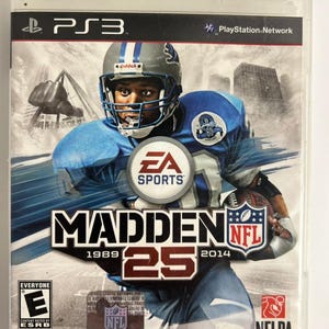 May include: A PlayStation 3 video game case for Madden NFL 25 featuring a football player in a blue uniform and silver helmet. The cover displays the EA Sports logo, the NFL shield, the NFLPA logo, and an ESRB Everyone rating symbol.