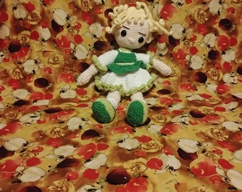 Cute yellow and green doll